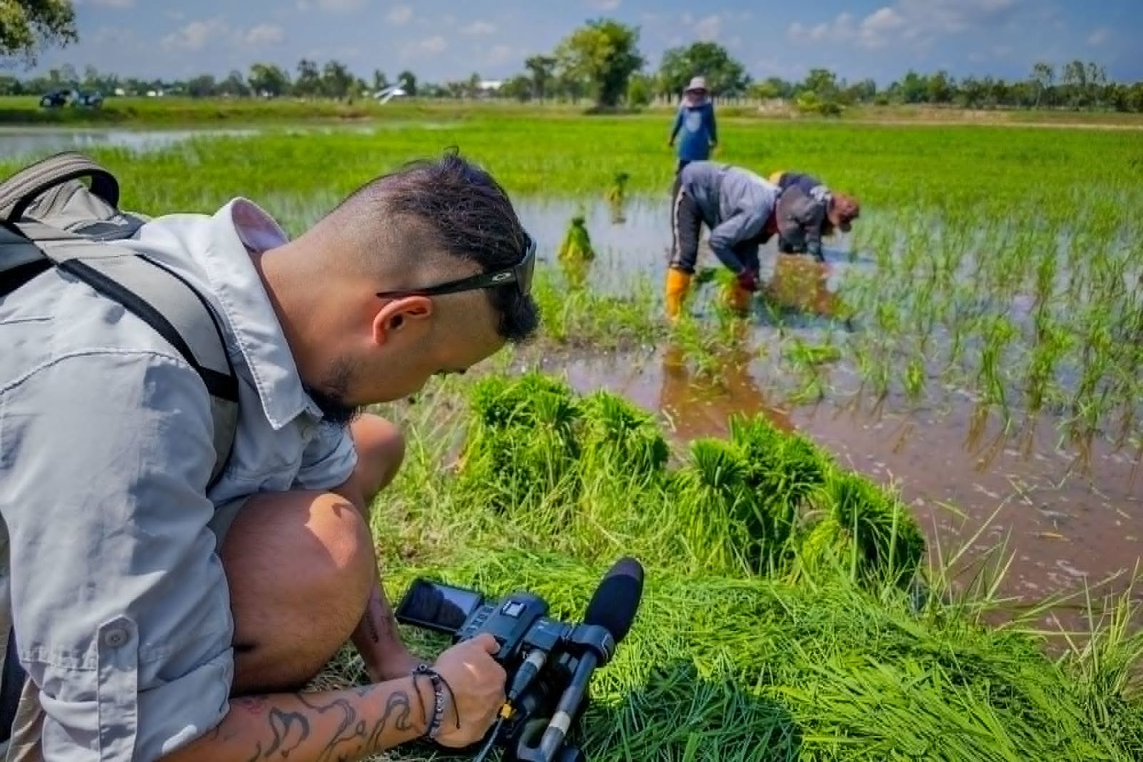 Aakashman filming in a rice field